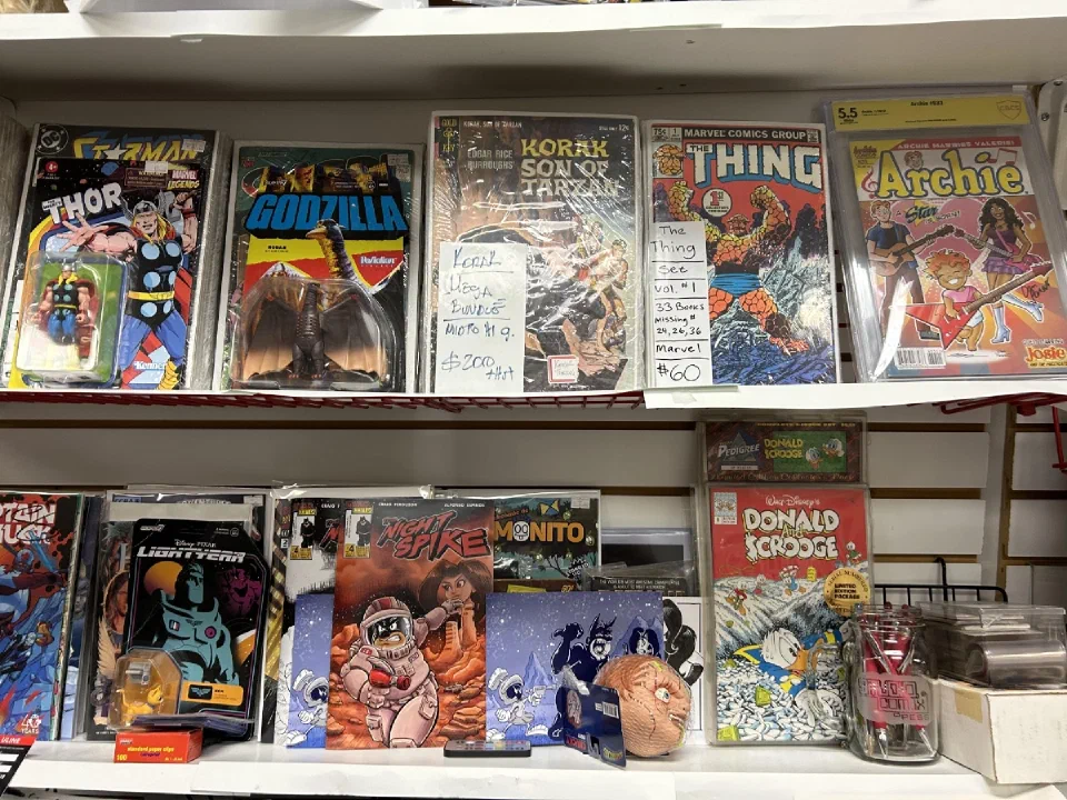 New releases faced out along a shop wall, with graded books above them